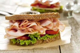 Closeup of a classic ham and cheese sandwich. Selective focus; shallow depth of field.