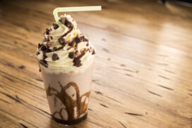 Chocolate Milk Shake - Frappe topped with whipped cream and chocolate sauce with chocolate pieces.