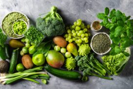 Variety of Green Vegetables and Fruits on the grey background