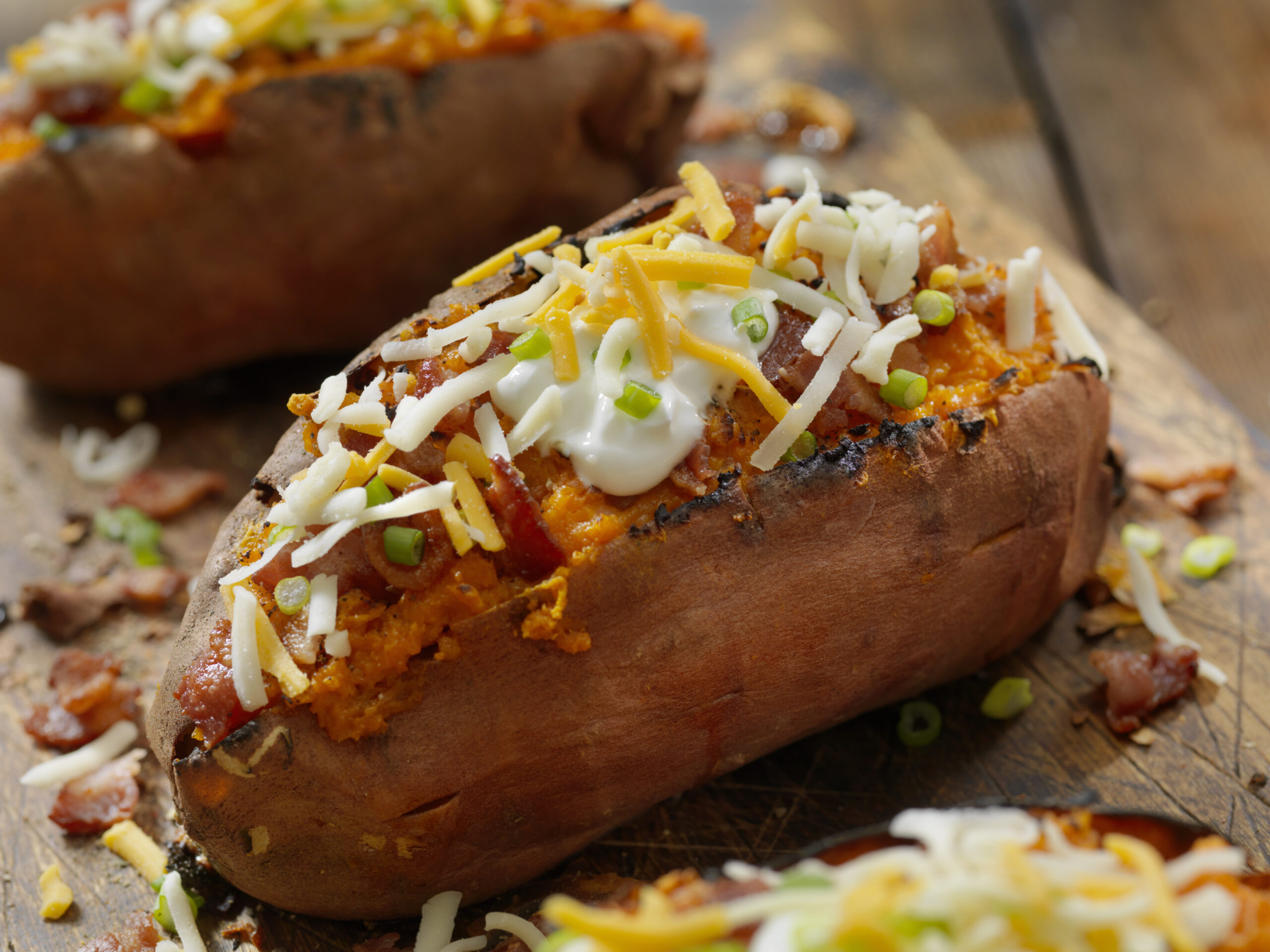 Loaded, Twice Baked Sweet Potato with Bacon, Cheese, Green Onions and Sour Cream